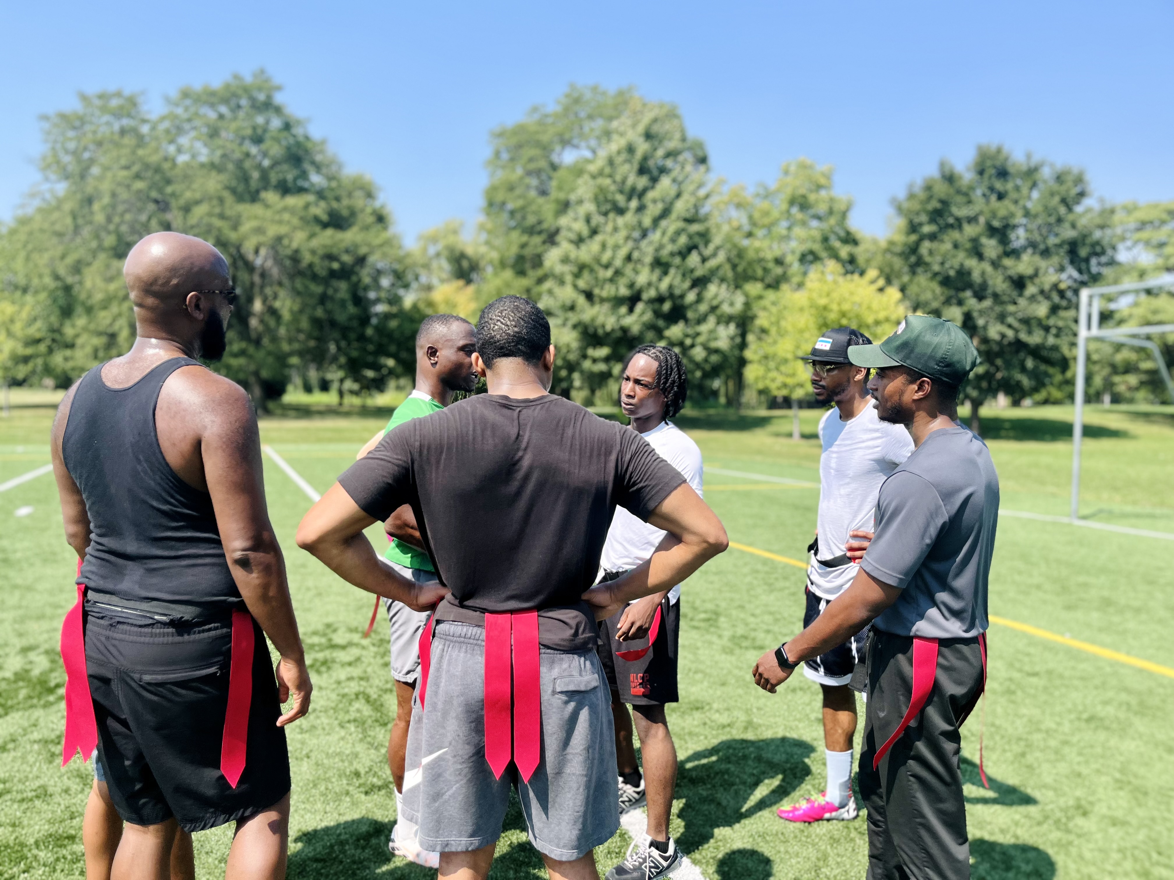Team smiling in huddle